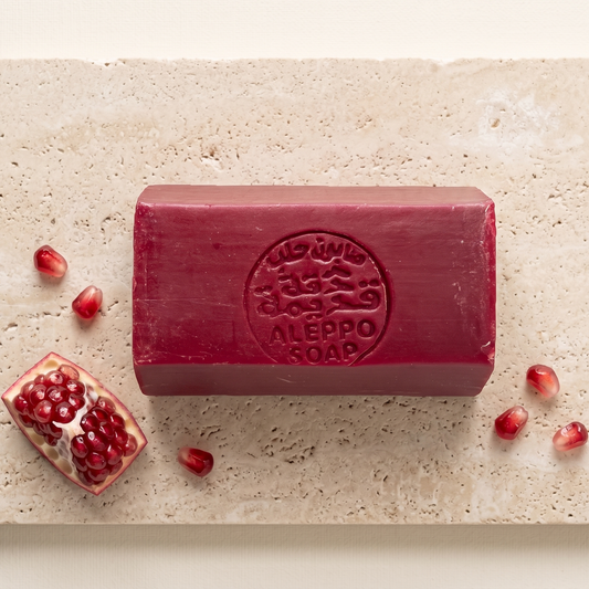 Pomegranate Musk Aleppo Soap by Dakka Kadima — red stamped soap bar with pomegranate and seeds