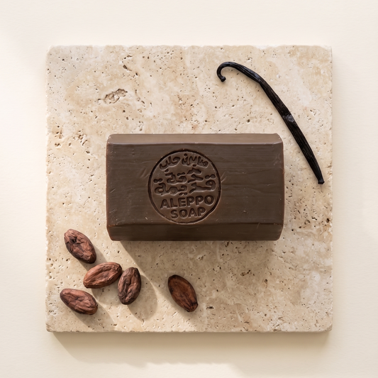 Vanilla & Chocolate Musk Aleppo Soap by Dakka Kadima — brown stamped soap bar with vanilla pod and cacao beans