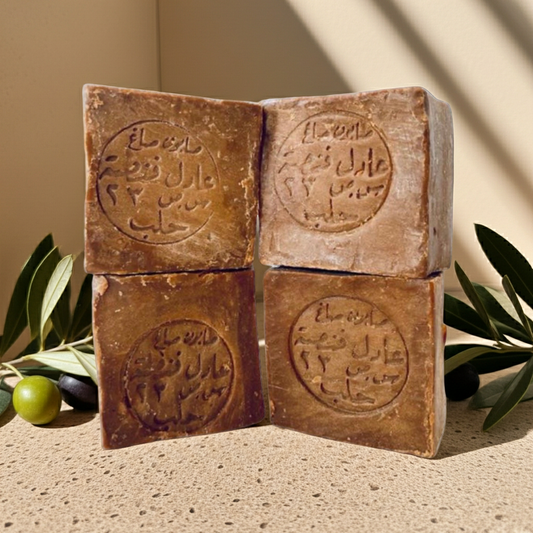 Aleppo Laurel Soap Collection by Fansa — four tan bars stacked