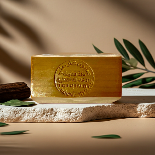 Oud Musk Aleppo Soap by Dakka Kadima — amber stamped soap bar with dark wood and olive leaves
